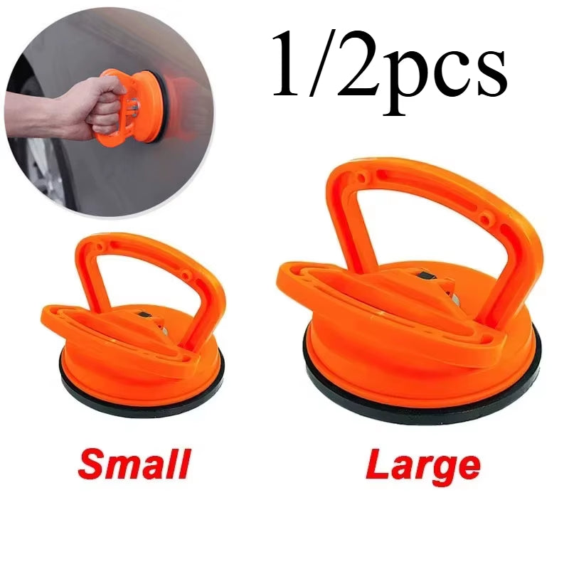Effortlessly Remove Dents with Our 2-Inch Black/Orange Suction Cup Car Repair Tool