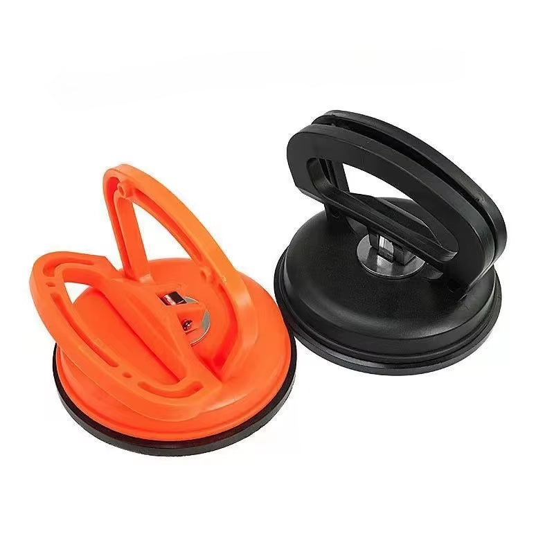 Effortlessly Remove Dents with Our 2-Inch Black/Orange Suction Cup Car Repair Tool